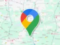 Ikona Google Maps na tle mapy. To narzędzie, które pozwala śledzić google maps historia podróży i odkrywać nowe miejsca.