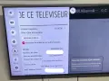 Ekran telewizora LG z menu ustawień, widoczne opcje: Sieć, Ogólne, Bezpieczeństwo.