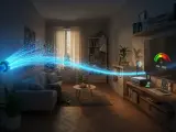 Światłowód dostarcza szybki internet do salonu, gdzie router zapewnia stabilne wifi 4. Telewizor pokazuje wskaźnik prędkości.