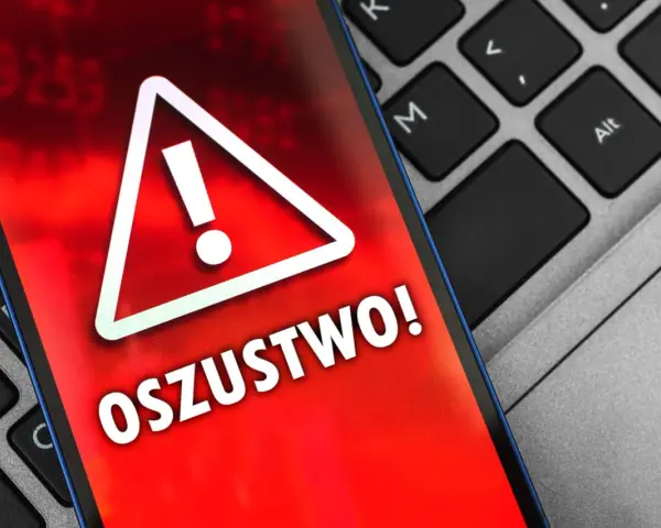 Oszustwo na OLX! Czerwony ekran telefonu z wykrzyknikiem ostrzega przed oszustami. Uważaj na podejrzane oferty.