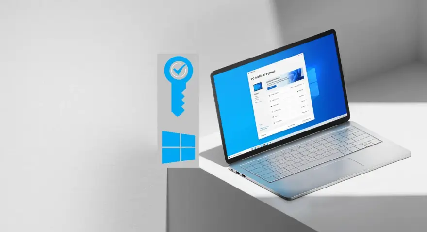 Grafika klucza z symbolem Windows i otwarty laptop z systemem Windows 11.