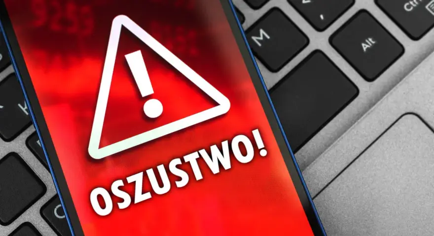Oszustwo na OLX! Czerwony ekran telefonu z wykrzyknikiem ostrzega przed oszustami. Uważaj na podejrzane oferty.